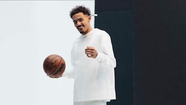 Trae Young wearing black and white shoes.